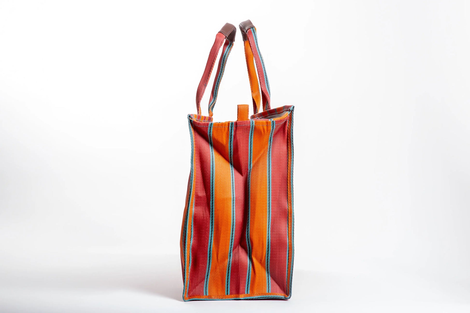 Explorer bag in brick and blaze colors, made of recycled nylon, from Less is Bore